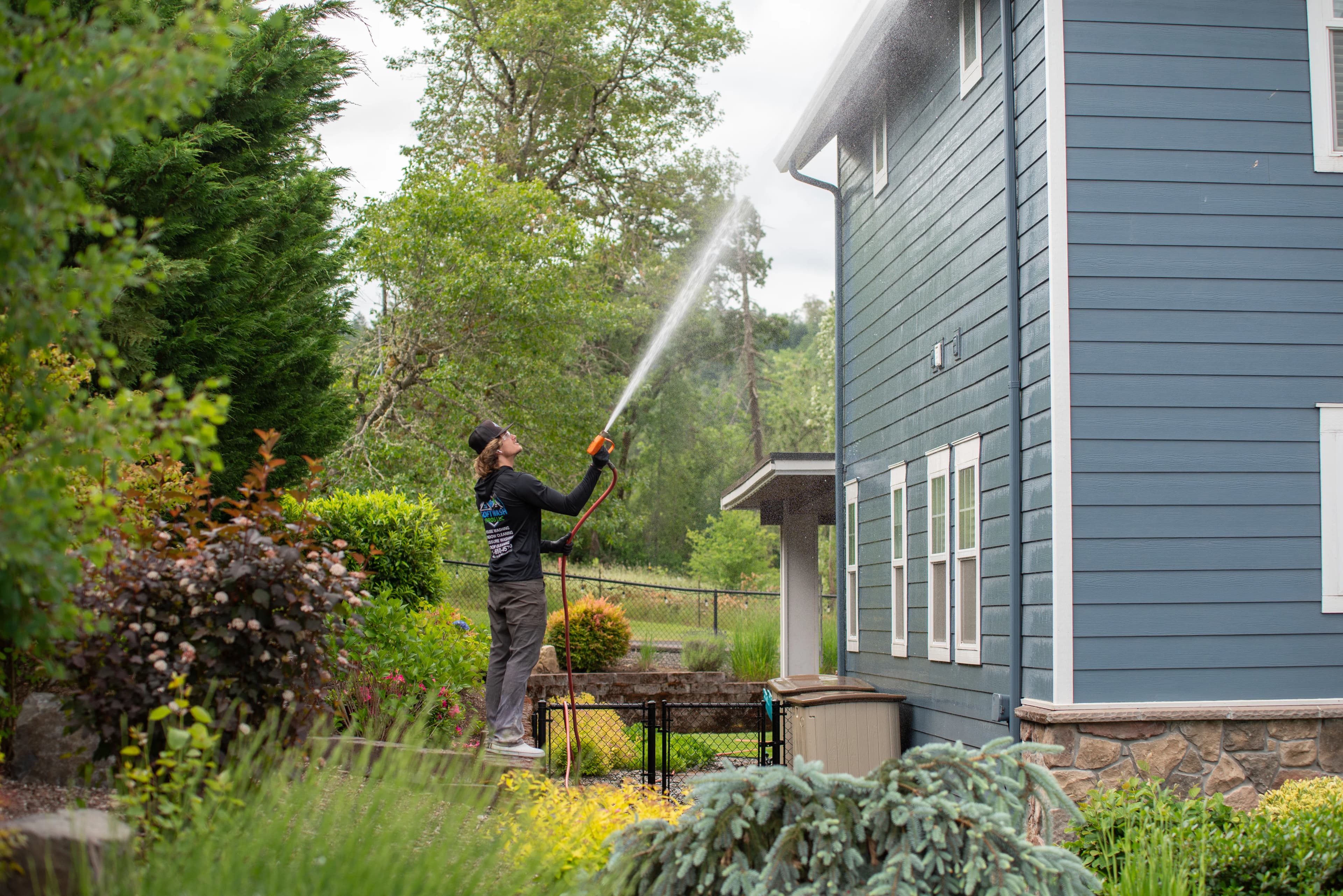 Freshly cleaned two-story craftsman home with manicured lawn